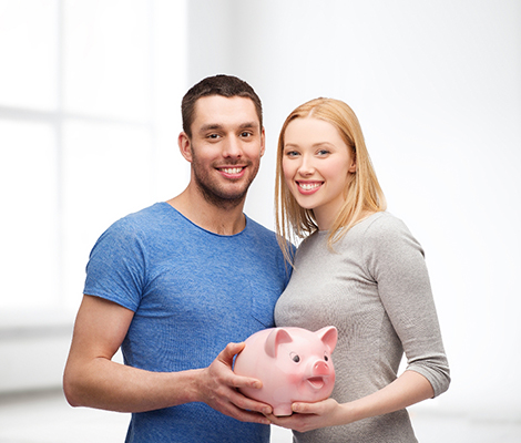 couple holding a piggy bank